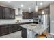 Modern kitchen with stainless steel appliances and granite countertops at 17152 W Grant St, Goodyear, AZ 85338