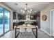 Modern kitchen with dark cabinetry, granite counters, and stainless steel appliances at 17152 W Grant St, Goodyear, AZ 85338