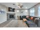 Cozy living room with fireplace and large TV at 17152 W Grant St, Goodyear, AZ 85338