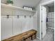 Inviting mudroom with built-in bench, hooks, and storage at 17152 W Grant St, Goodyear, AZ 85338