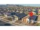 Single-story home with red tile roof in a community at 19930 W Exeter Blvd, Litchfield Park, AZ 85340