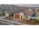 Single-story home with red tile roof in a community at 19930 W Exeter Blvd, Litchfield Park, AZ 85340