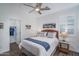 Cozy bedroom with wicker headboard and adjacent closet at 19930 W Exeter Blvd, Litchfield Park, AZ 85340