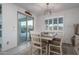 Casual dining area with sliding door to patio and pool at 19930 W Exeter Blvd, Litchfield Park, AZ 85340