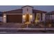 Single story home with Spanish tile roof and landscaping at 19930 W Exeter Blvd, Litchfield Park, AZ 85340