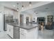 Modern kitchen island with white cabinets and gray countertops at 19930 W Exeter Blvd, Litchfield Park, AZ 85340