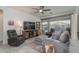 Relaxing living room with sliding doors to backyard pool at 19930 W Exeter Blvd, Litchfield Park, AZ 85340