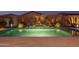 Stunning pool and spa at night with beautiful landscaping at 19930 W Exeter Blvd, Litchfield Park, AZ 85340