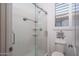 Clean shower with glass enclosure and built-in shelving at 19930 W Exeter Blvd, Litchfield Park, AZ 85340