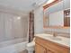 Clean bathroom with shower/tub combo and wood vanity at 215 E Marconi Ave, Phoenix, AZ 85022