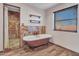 Relaxing bathroom with clawfoot tub and walk-in shower at 215 E Marconi Ave, Phoenix, AZ 85022