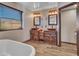 Bathroom with copper vessel sinks and rustic vanity at 215 E Marconi Ave, Phoenix, AZ 85022