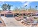 Single-story home with landscaped yard and driveway at 215 E Marconi Ave, Phoenix, AZ 85022