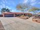 House with a large front yard and landscaping at 215 E Marconi Ave, Phoenix, AZ 85022