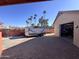 Attached garage with open door revealing workshop and trailer at 215 E Marconi Ave, Phoenix, AZ 85022