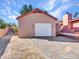 Detached garage with white door and brick paver driveway at 215 E Marconi Ave, Phoenix, AZ 85022