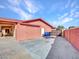 Attached garage with a large sliding door at 215 E Marconi Ave, Phoenix, AZ 85022