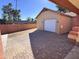 Detached garage with white door and brick paver driveway at 215 E Marconi Ave, Phoenix, AZ 85022