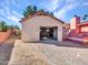 Detached garage with ample space and brick paved driveway at 215 E Marconi Ave, Phoenix, AZ 85022