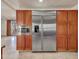 Stainless steel appliances and wood cabinetry in this modern kitchen at 215 E Marconi Ave, Phoenix, AZ 85022