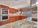 Modern kitchen with granite countertops and stainless steel appliances at 215 E Marconi Ave, Phoenix, AZ 85022