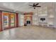 Living room features a fireplace, built-in shelving, and tile flooring at 215 E Marconi Ave, Phoenix, AZ 85022