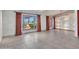 Spacious living room with tile floors and large windows at 215 E Marconi Ave, Phoenix, AZ 85022