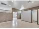 Large office area with room divider and access to bathroom at 215 E Marconi Ave, Phoenix, AZ 85022