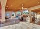 Outdoor kitchen with stainless steel appliances and stone counters at 215 E Marconi Ave, Phoenix, AZ 85022