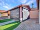 Covered patio with retractable shade and outdoor kitchen at 215 E Marconi Ave, Phoenix, AZ 85022