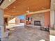 Covered patio features a stone fireplace and built-in kitchen at 215 E Marconi Ave, Phoenix, AZ 85022