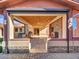 Covered patio with outdoor kitchen, fireplace and seating at 215 E Marconi Ave, Phoenix, AZ 85022