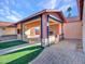 Covered patio with outdoor kitchen and fireplace at 215 E Marconi Ave, Phoenix, AZ 85022