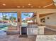 Stainless steel grill and outdoor kitchen with stone accents at 215 E Marconi Ave, Phoenix, AZ 85022