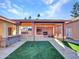 Outdoor kitchen and patio area with fireplace and built-in grill at 215 E Marconi Ave, Phoenix, AZ 85022