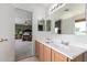 Double sink bathroom with view into bedroom at 30084 N Desert Willow Blvd, San Tan Valley, AZ 85143