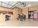 Garage with overhead storage, workbench, and two bikes at 30084 N Desert Willow Blvd, San Tan Valley, AZ 85143