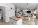 Kitchen island with view into living and dining areas at 30084 N Desert Willow Blvd, San Tan Valley, AZ 85143