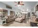 Bright living room features hardwood floors, comfy sofas, and an open floor plan at 30084 N Desert Willow Blvd, San Tan Valley, AZ 85143