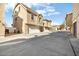 Rear view of townhome showing garage and surrounding area at 3039 W Sand Flower Dr, Phoenix, AZ 85086