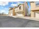 View of attached two-car garage and driveway at 3039 W Sand Flower Dr, Phoenix, AZ 85086