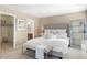 Large main bedroom with plush bed, ample closet space, and bench at foot of bed at 3039 W Sand Flower Dr, Phoenix, AZ 85086