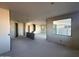 Unfinished living room with a window and staircase at 32111 N Saddlehorn Dr, San Tan Valley, AZ 85140