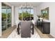 Bright dining area with large windows and modern chandelier at 32355 N 19Th Ln, Phoenix, AZ 85085