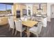 Kitchen dining area with a wood table and woven chairs at 32359 N 19Th Ln, Phoenix, AZ 85085