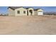 Newly built one-story house with desert landscaping and a two-car garage at 33406 W Campbell Ave, Tonopah, AZ 85354