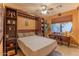 Guest bedroom with a Murphy bed and built-in shelves at 3604 N 162Nd Ave, Goodyear, AZ 85395