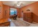 Bedroom with a large wooden dresser and an antique writing desk at 3604 N 162Nd Ave, Goodyear, AZ 85395