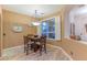 Cozy dining area with a table and four chairs near a window at 3604 N 162Nd Ave, Goodyear, AZ 85395