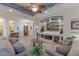 Bright living room with comfy seating and built-in entertainment center at 3604 N 162Nd Ave, Goodyear, AZ 85395